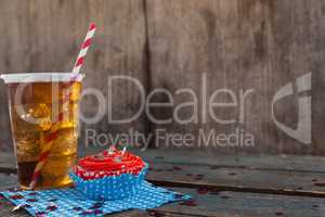 Decorated cupcake and cold drink with 4th july theme