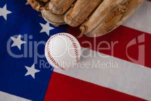 Baseball and gloves on an American flag