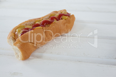 Hot dog on wooden table