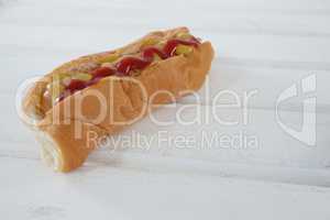 Hot dog on wooden table