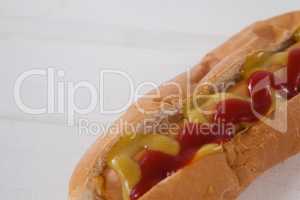 Hot dog on white wooden table