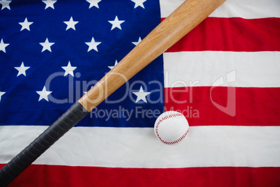 Baseball and baseball bat on an American flag