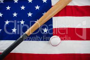 Baseball and baseball bat on an American flag