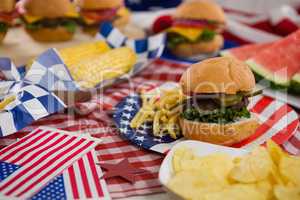 Burger and potato chips with 4th July theme