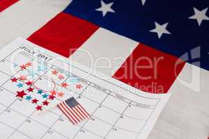 Calendar marked with star shape decoration and American flag