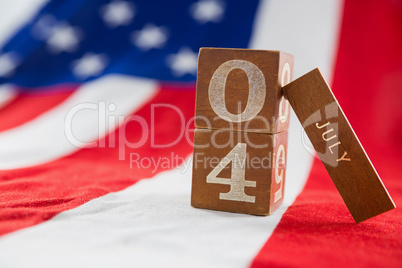 Date blocks on American flag with 4th july theme