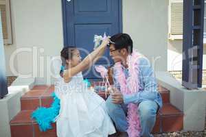 Father and daughter in fairy costume