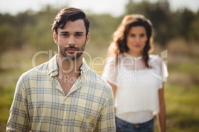 Handsome young man with woman at farm