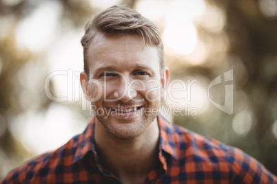 Portrait of smiling young man at farm