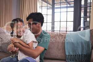 Happy father and daughter having fun in living room