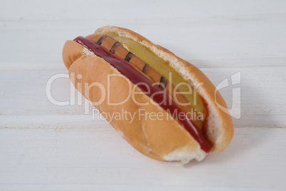 Hot dog on wooden table