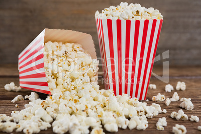 Scattered popcorn on wooden table