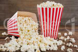 Scattered popcorn on wooden table