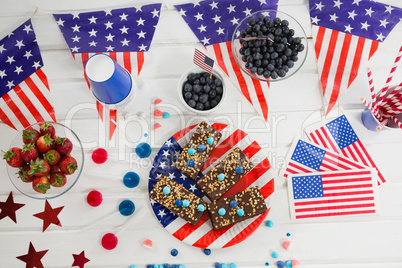 Sweet food and fruits decorated with 4th july theme