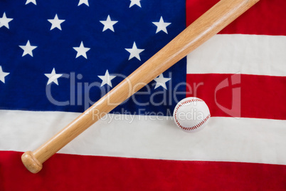 Baseball and baseball bat on an American flag