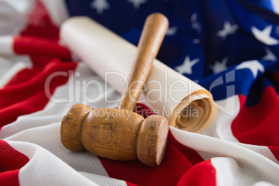 Gavel and legal document arranged on American flag