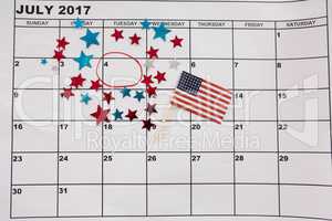 Calendar marked with star shape decoration and American flag