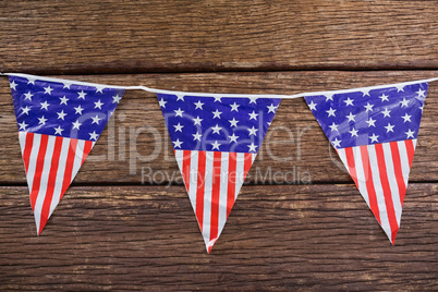 Patriotic bunting arranged on wooden table