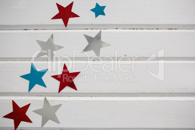 Star shape decoration arranged on wooden table
