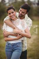 Portrait of smiling woman standing with boyfriend