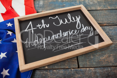 American flag and slate with text 4th july independence day