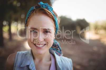 Portrait of smiling young woman at olive farm