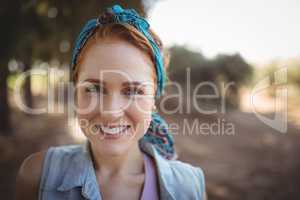 Portrait of smiling young woman at olive farm