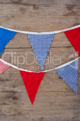 Bunting flags arranged on wooden table