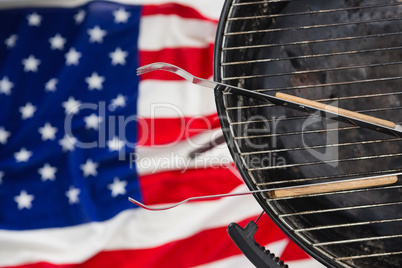 Tong arranged on barbeque against American flag