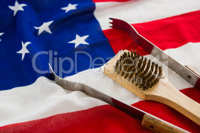 Tong and brush on American flag