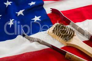 Tong and brush on American flag