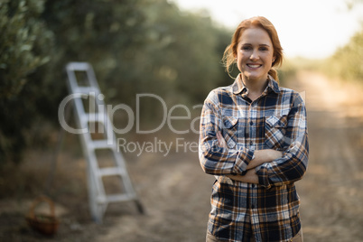 Smiling female standing at farm