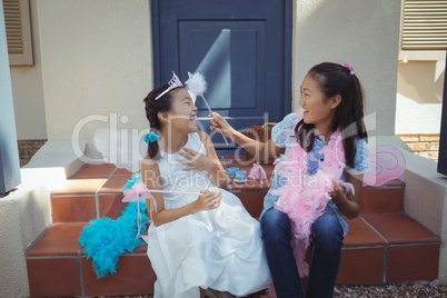 Siblings having fun in fairy costume