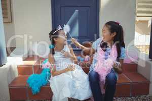 Siblings having fun in fairy costume