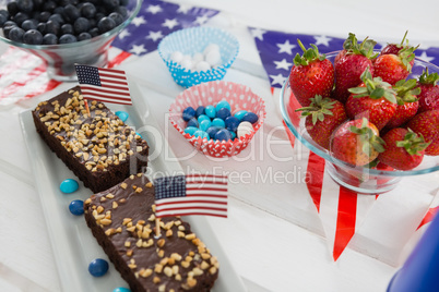 Close-up of sweet food and strawberries decorated with 4th july theme