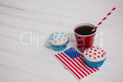 Decorated cupcakes and cold drink with 4th july theme