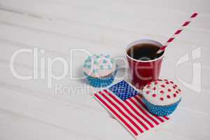 Decorated cupcakes and cold drink with 4th july theme