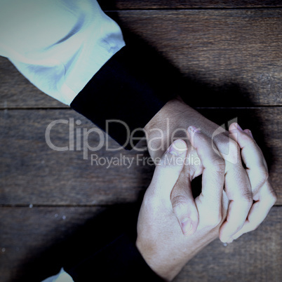 Woman praying on wooden table