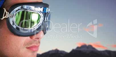 Composite image of close up of man wearing aviator goggles