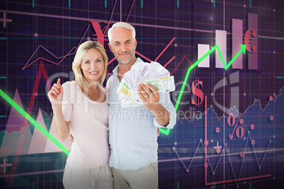 Composite image of husband holding money while standing with wife