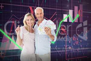 Composite image of husband holding money while standing with wife