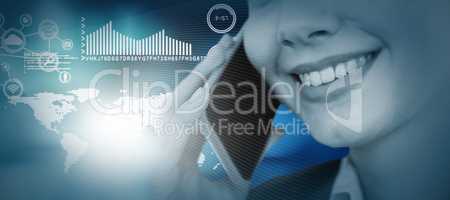 Composite image of close up of smiling businesswoman talking on mobile phone