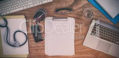 Various equipment and technologies on doctors desk in hospital