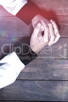 Woman praying on wooden table