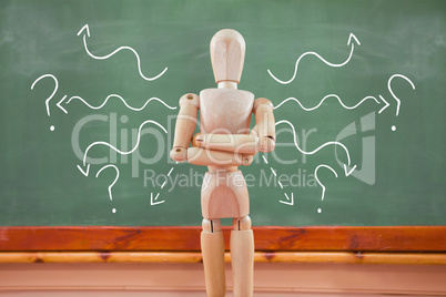 Composite image of 3d image of wooden figurine standing with arms crossed