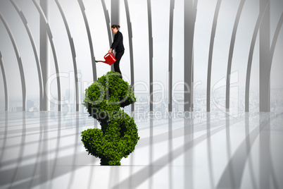 Composite image of businesswoman using red watering can