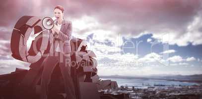 Composite image of businesswoman talking on a megaphone