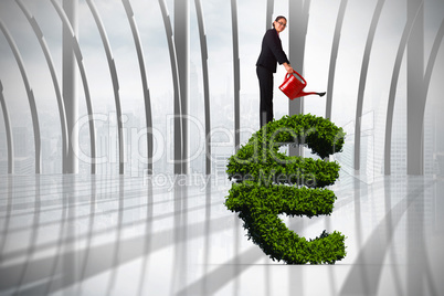 Composite image of businesswoman using red watering can