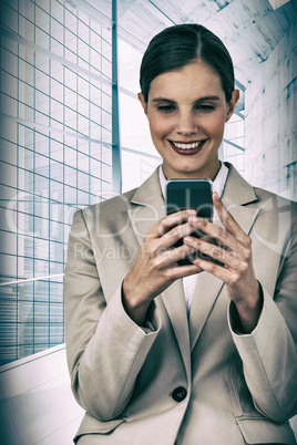 Composite image of smiling businesswoman using mobile phone