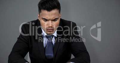 Composite image of businessman typing on keyboard at desk